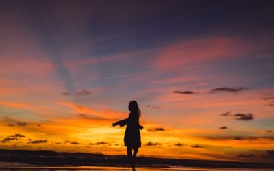 people-beach-sunset-girl-is-jumping-against-backdrop-setting-sun